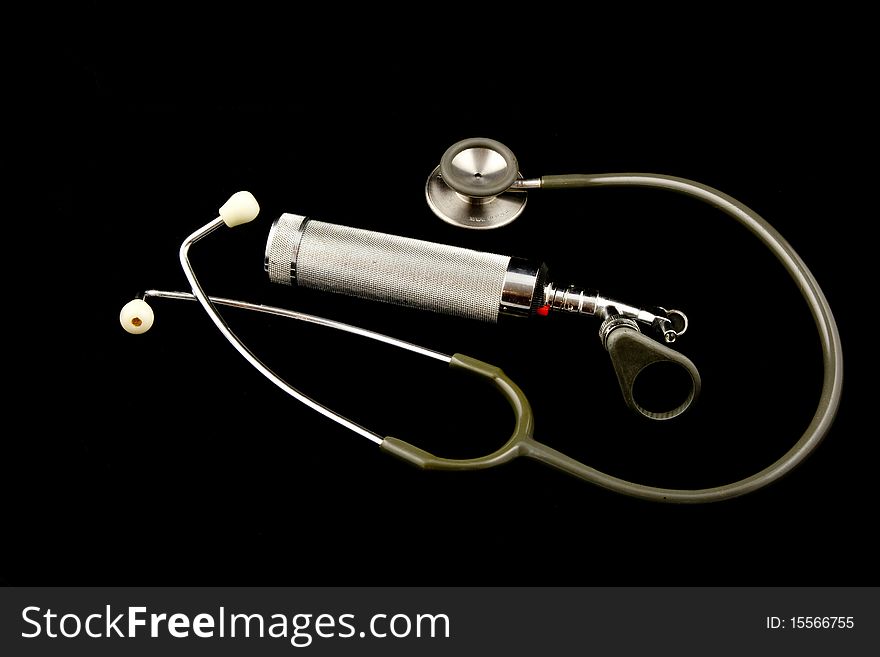 This is an image of an atique stethoscope and otoscope. This is an image of an atique stethoscope and otoscope.