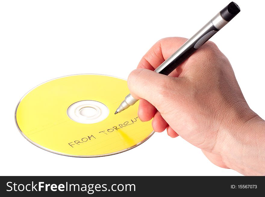 Man's hand writing on DVD with content from torrents