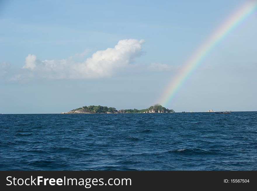 Photo of rainbow on top of an island at belitung indonesia