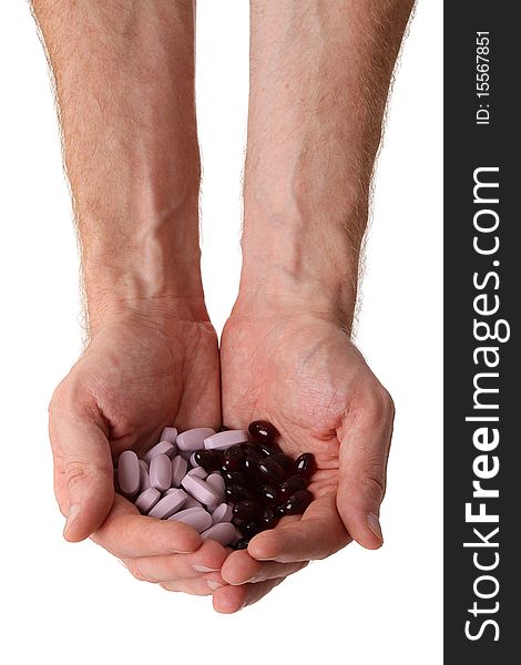 Pills in two male hands