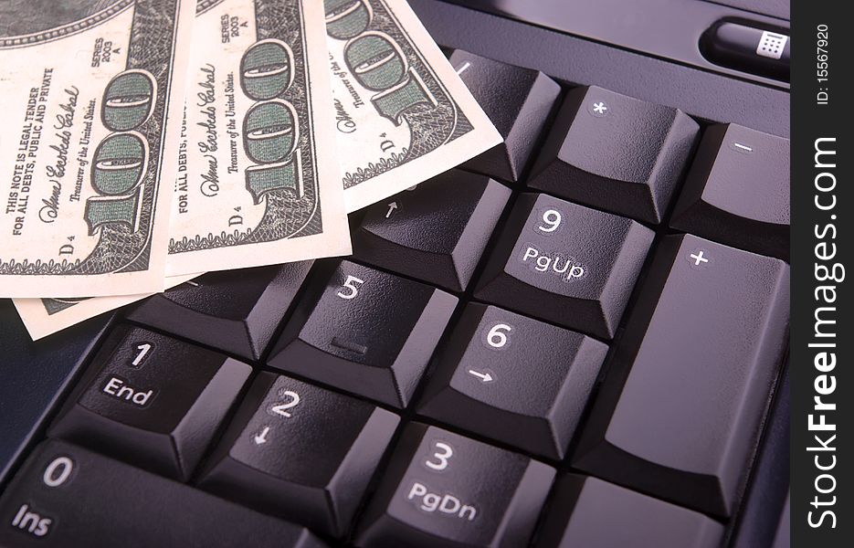 Close-up of keyboard and dollars. Close-up of keyboard and dollars