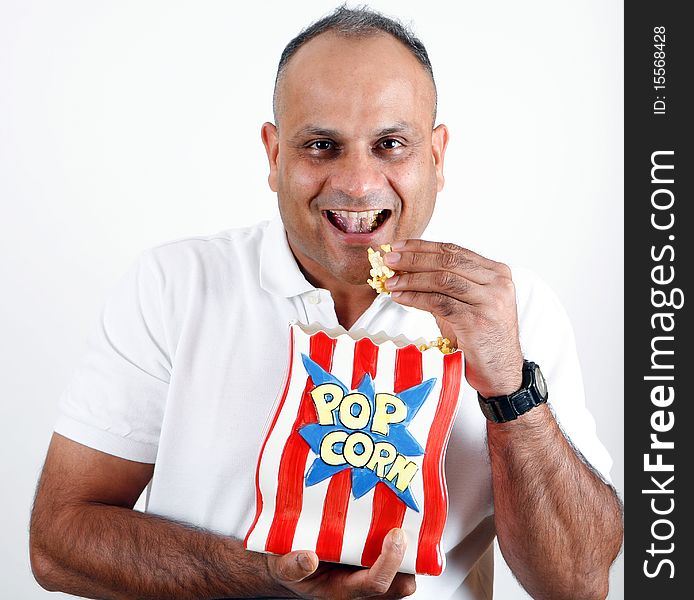 Office worker eating popcorn and enjoying