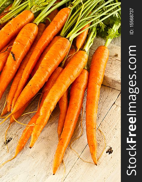 Fresh wet carrots on a farmers table. Fresh wet carrots on a farmers table