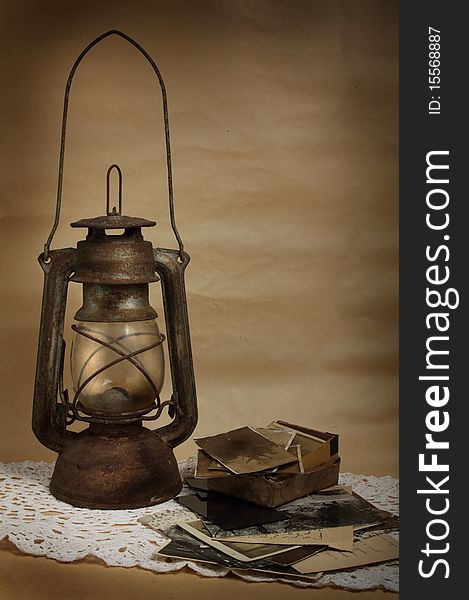 Old kerosene lamp and photos