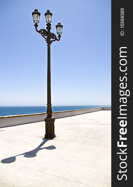 Street lamp over the ocean
