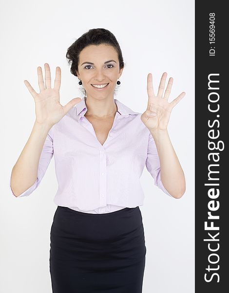 Young woman counting the number nine in front of a white background. Young woman counting the number nine in front of a white background