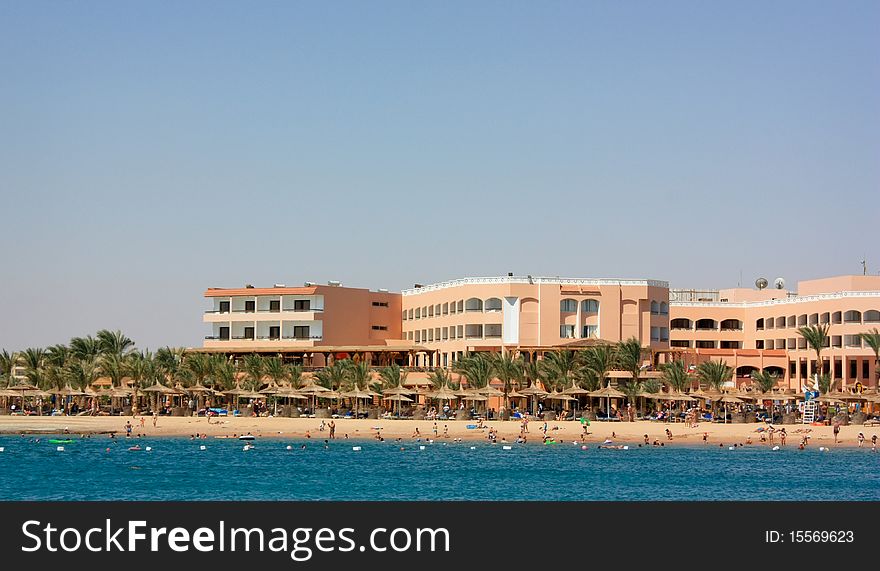 Hotels and sandy beach at coast of the warm sea. Hotels and sandy beach at coast of the warm sea