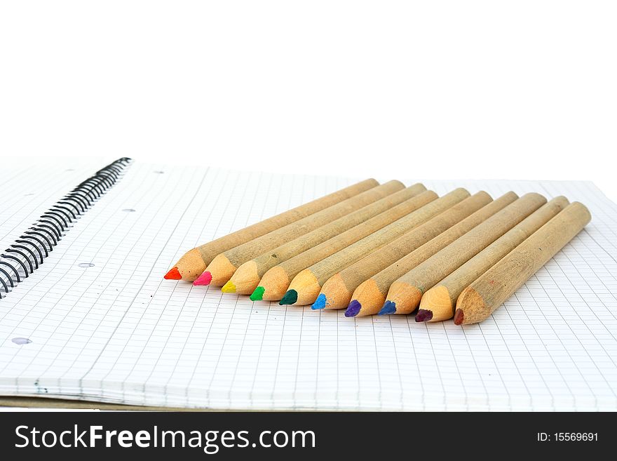 Wooden color pencils isolated on a white background