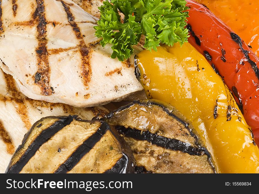 Grilled chicken breasts and colorful vegetables. Grilled chicken breasts and colorful vegetables