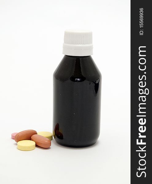 Medicine bottle and pills isolated on white background. Medicine bottle and pills isolated on white background