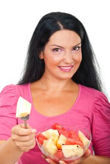 Smiling Woman Giving A Piece Of Melon Royalty Free Stock Image