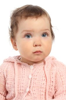 Cute Little Baby In A Pink Jumper Looks Up Royalty Free Stock Photography Cute Little Baby In A Pink Jumper Looks Up Royalty Free Stock Photography