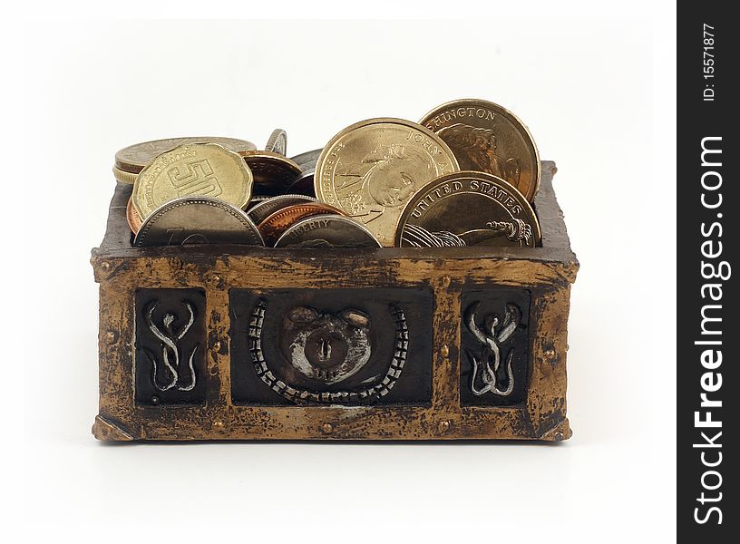 Miniature treasure chest full of coins on white background. Miniature treasure chest full of coins on white background