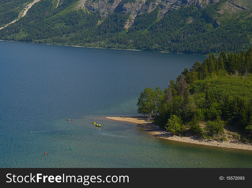 People Kayaking in Waterton Lakes National Park, Alberta, Canada. People Kayaking in Waterton Lakes National Park, Alberta, Canada