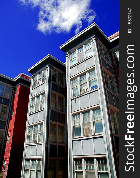 Rows of Apartment Buildings with Blue Sky in Background