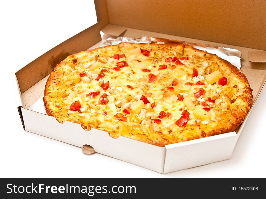 Fresh pizza in open box isolated on white. Light shadow. Fresh pizza in open box isolated on white. Light shadow