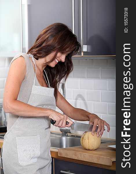 Woman cutting melon