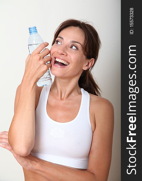Closeup of woman drinking water after exercising. Closeup of woman drinking water after exercising