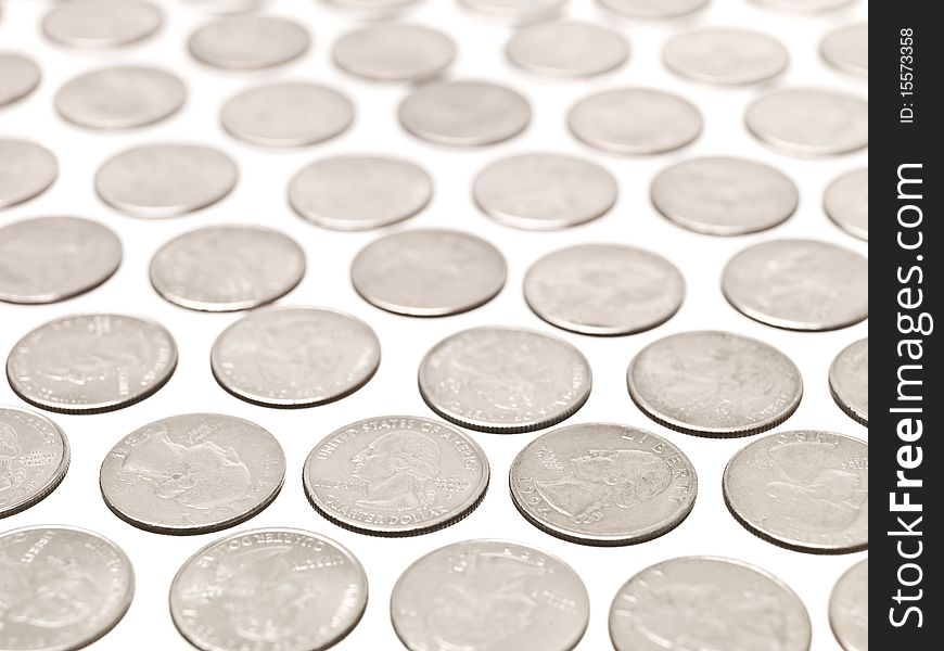 Arranged Quarter coins on white background
