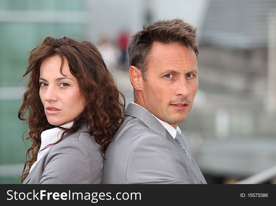 Portrait of business partners standing outside. Portrait of business partners standing outside