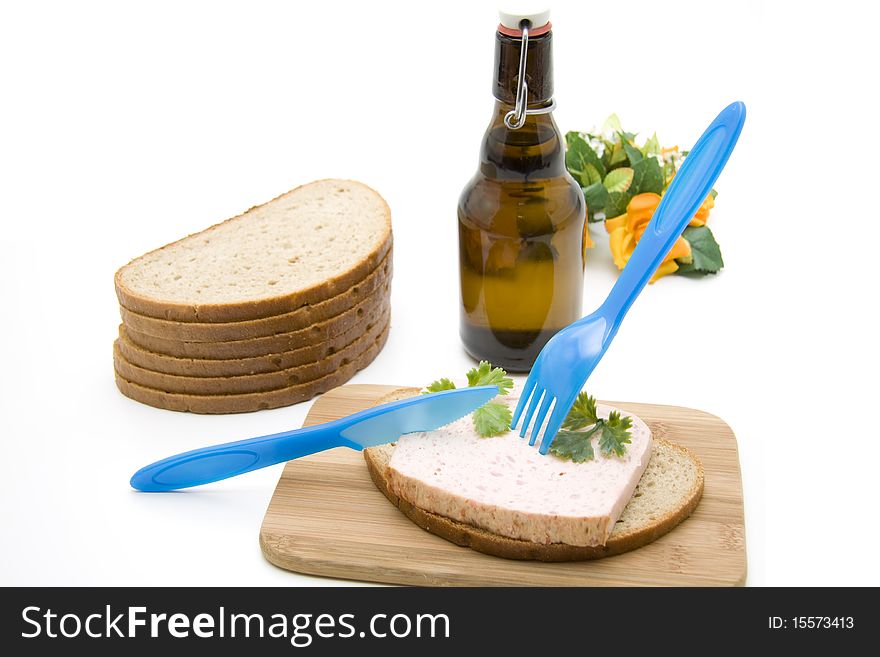 Wheat bread with sausage and beer bottle. Wheat bread with sausage and beer bottle