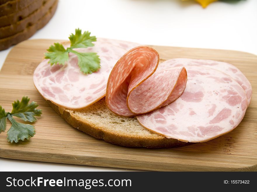 Wheat bread with sausage and parsley