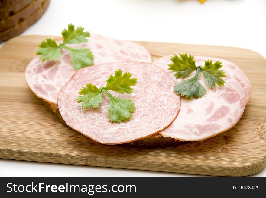 Wheat bread with sausage and parsley