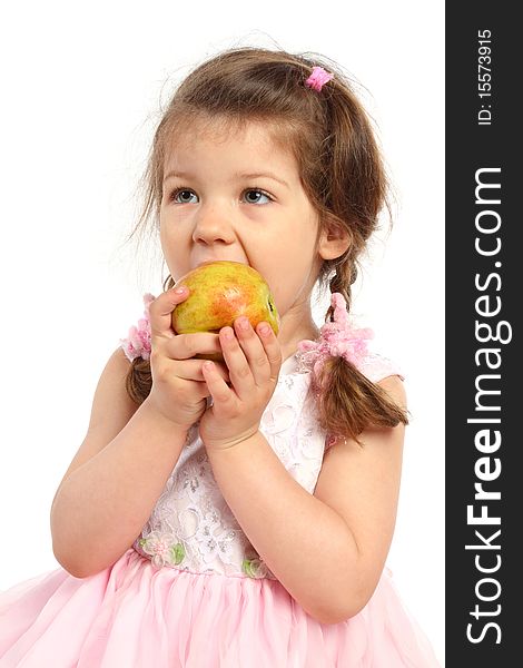Beautiful little girl with pigtails eating apple. Beautiful little girl with pigtails eating apple