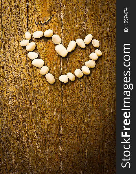 Heart on the wood background