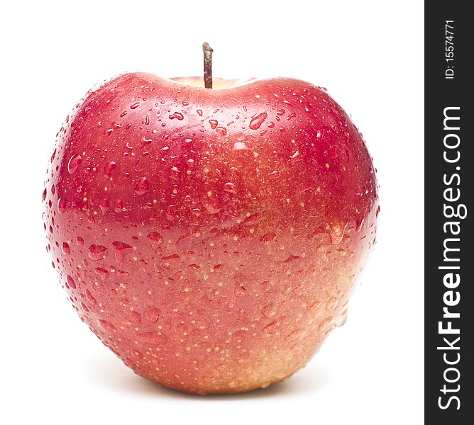 Wet red apple covered by water drops on white background. Isolation