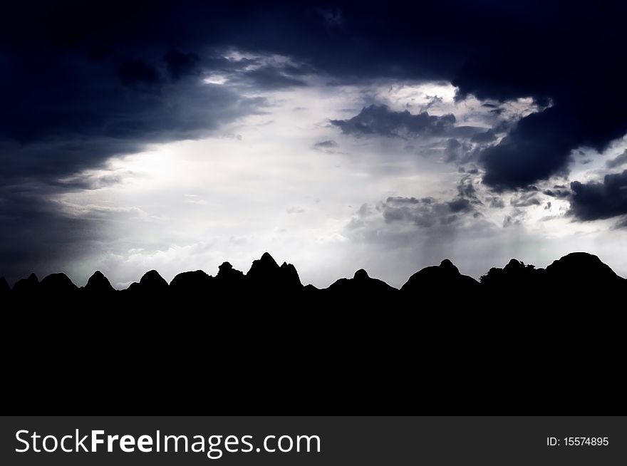 Karst peaks silhouetted against the dusk sky, Guilin, Guangxi Province, China. Karst peaks silhouetted against the dusk sky, Guilin, Guangxi Province, China