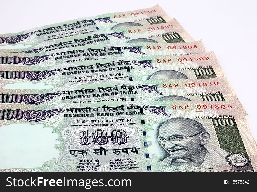 Indian money notes currency spread over white background