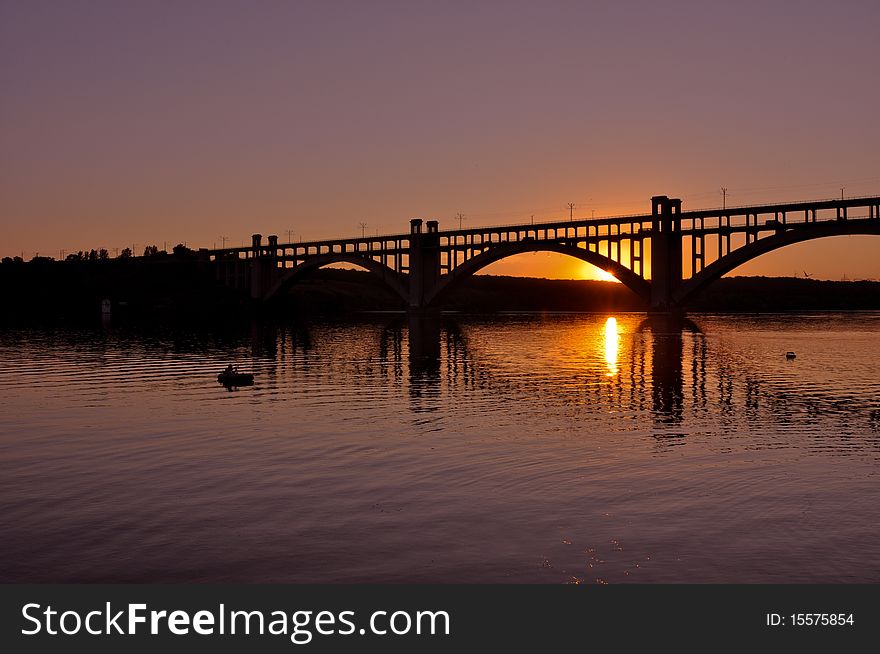 Sunset scene with bridge over the river. Sunset scene with bridge over the river