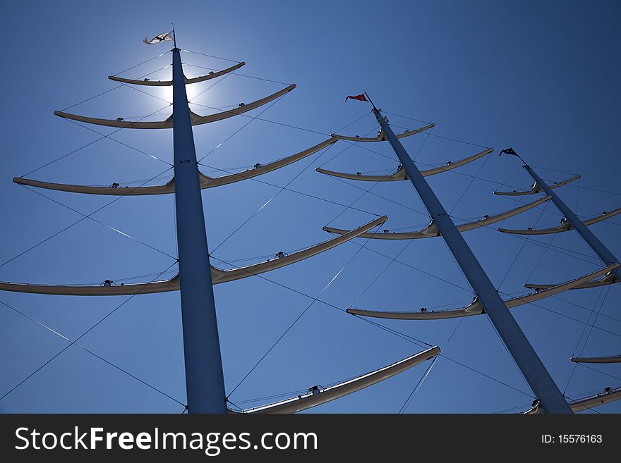 Masts in blue sky. Greece