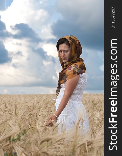 Women in white dress in the wheat field. Women in white dress in the wheat field