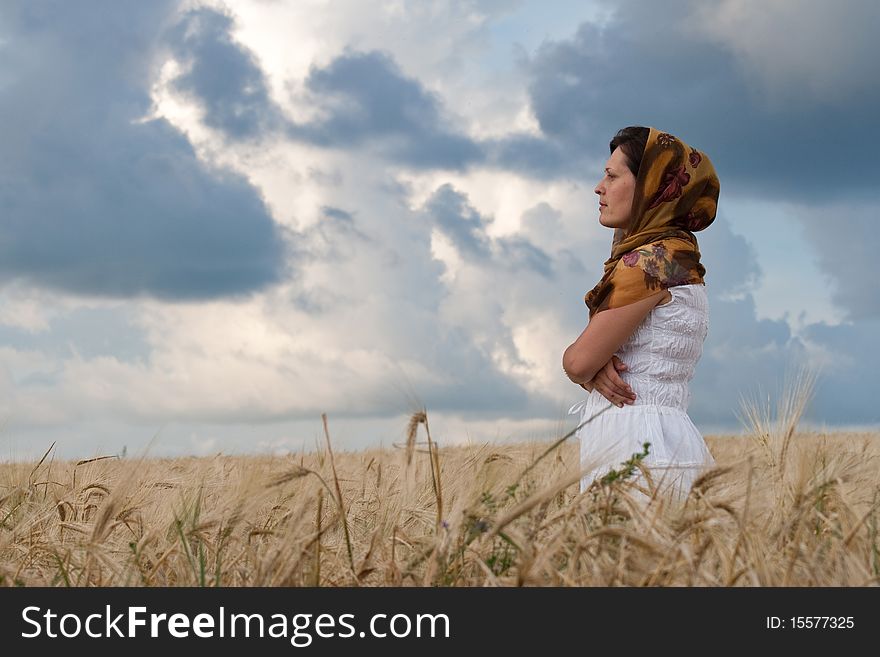 Women in white dress in the wheat field. Women in white dress in the wheat field