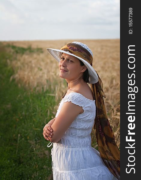 Lady in white dress and hat in the wheat field. Lady in white dress and hat in the wheat field