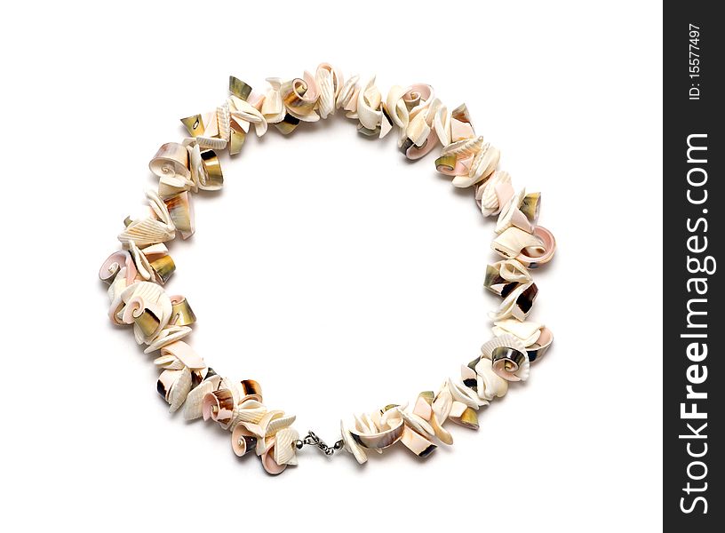 Beads from cockleshells on a white background / 10