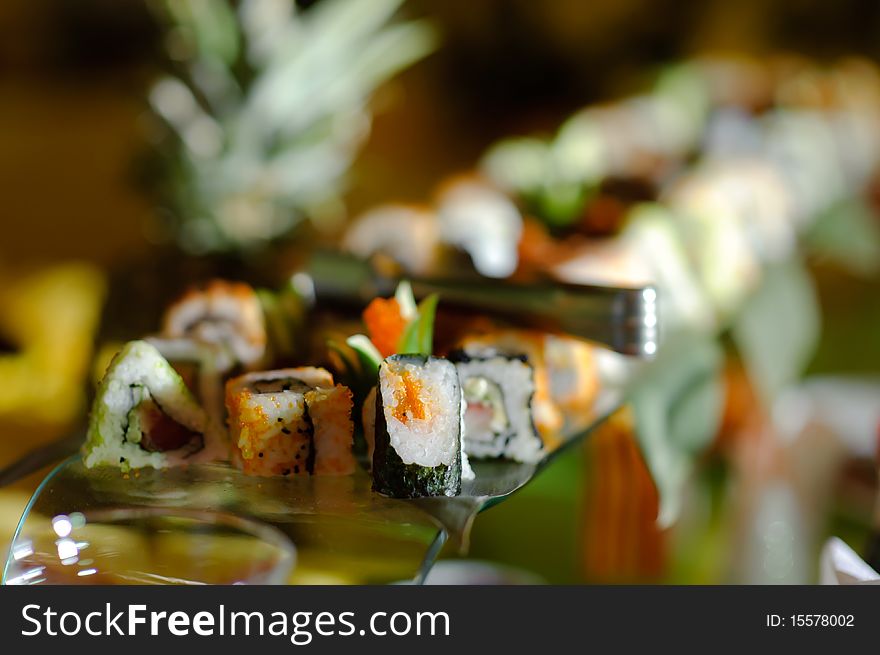 Japanese sushi on the glass stand. Japanese sushi on the glass stand