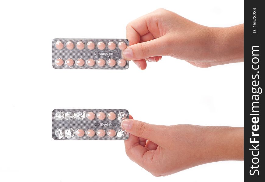 Two medical pills container on a female hand, isolated. Two medical pills container on a female hand, isolated