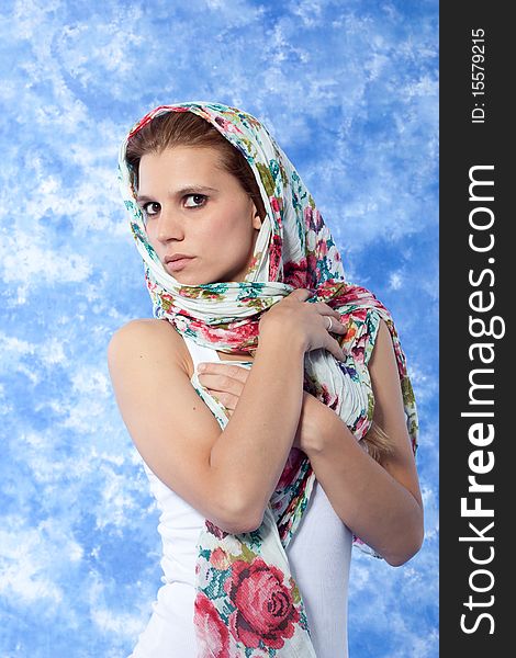 Female model posing with scarf over the head. Female model posing with scarf over the head
