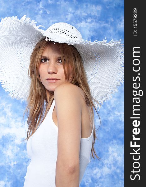 Female model posing with hat over the head. Female model posing with hat over the head