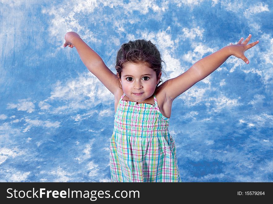 Cute little girl whit open arms on studio session