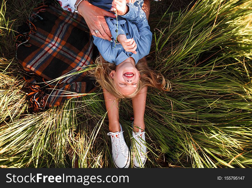 Mother and daughter hugging Beautiful summer nature. Space for text. Mother and daughter hugging Beautiful summer nature. Space for text.
