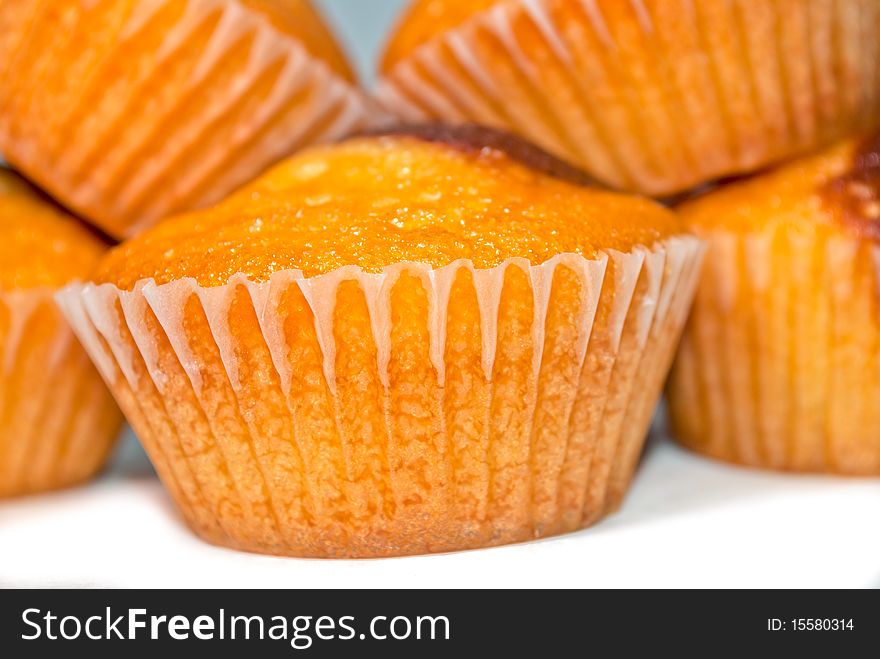 Caption of homemade muffins, isolated on white