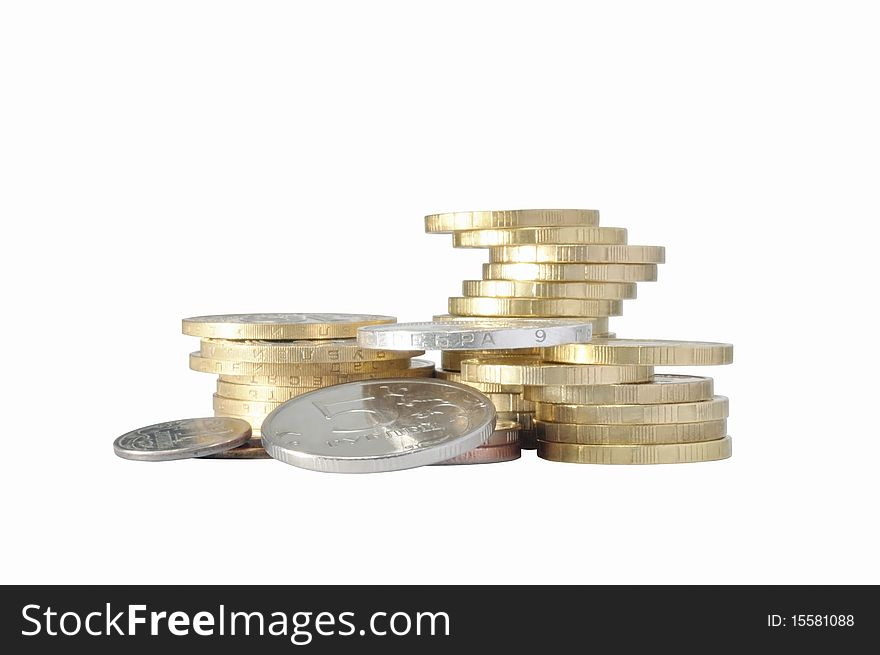 Piles of metal coins against white background. Piles of metal coins against white background