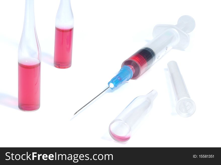 Disposable syringe and vaccine against white background