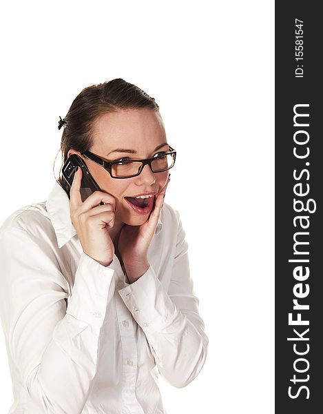 Beautiful girl getting good news on the phone, seen against white background