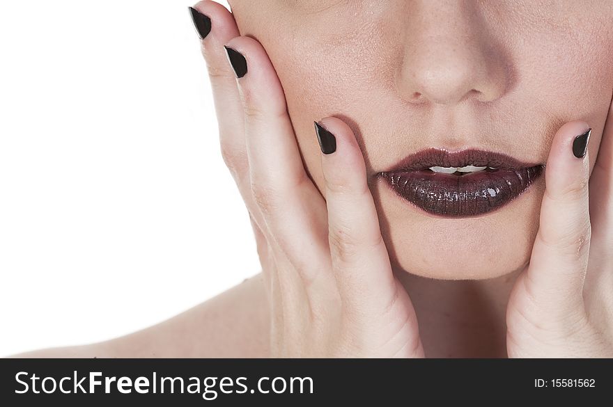 Beautiful girls mouth close up, seen against white background