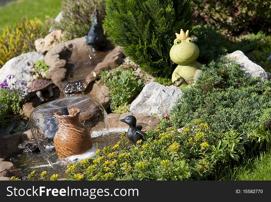 Detail of beautiful summer garden with water element